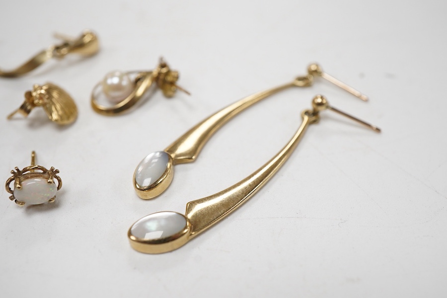 Three modern pairs of 9ct gold earrings, including spiral, triangular and moonstone set, together with five odd earrings.